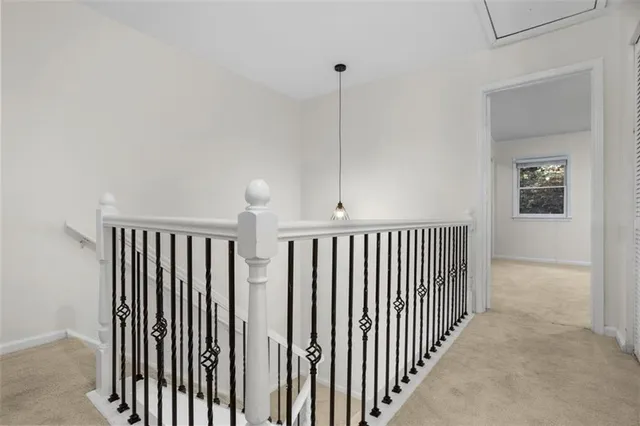 a view of a hallway with windows