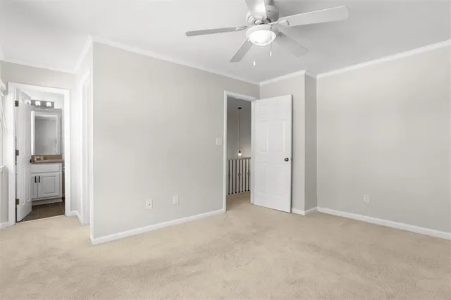 an empty room with a bathroom and a shower