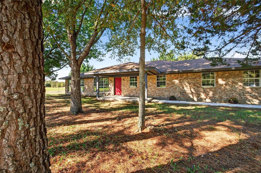 5023 West Line Road Whitesboro, TX 76273 - Photo 15 of 40 a view of a house with a yard