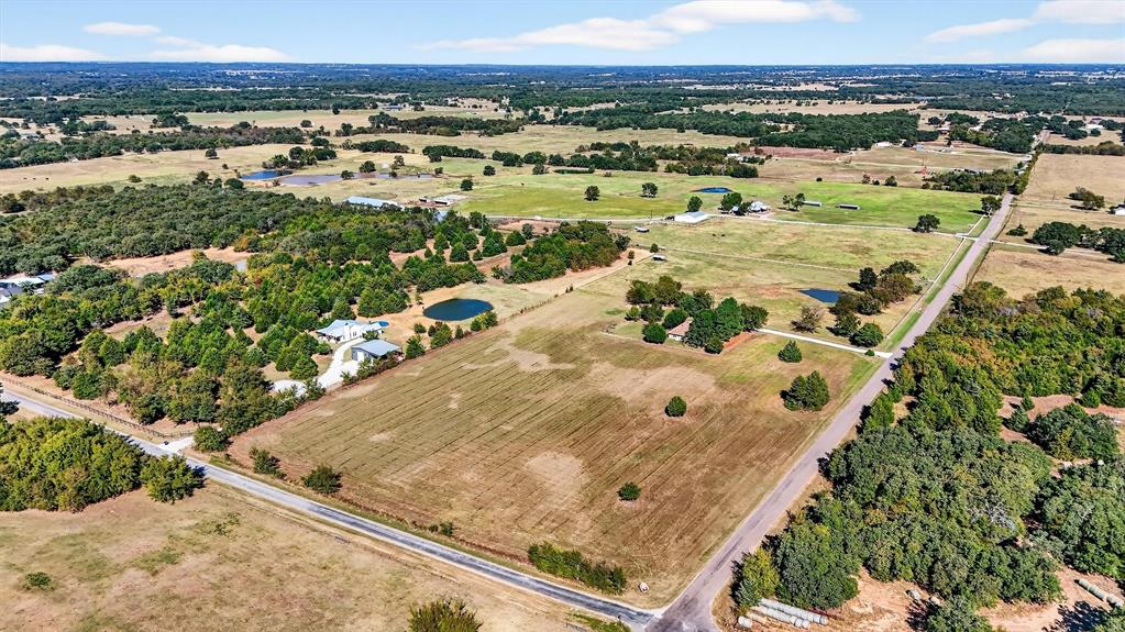 5023 West Line Road Whitesboro, TX 76273 - Photo 3 of 40 an aerial view of residential houses with outdoor space