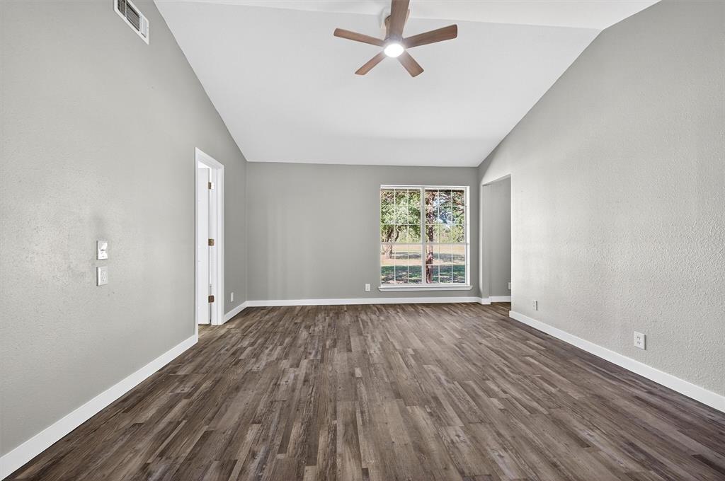 5023 West Line Road Whitesboro, TX 76273 - Photo 31 of 40 wooden floor in an empty room with a window