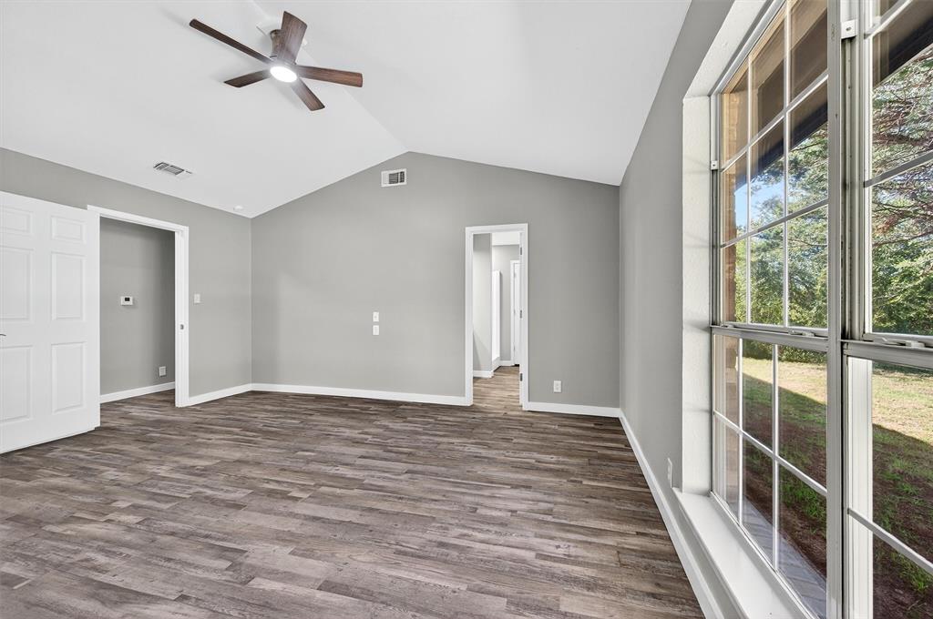 5023 West Line Road Whitesboro, TX 76273 - Photo 33 of 40 a view of an empty room with wooden floor