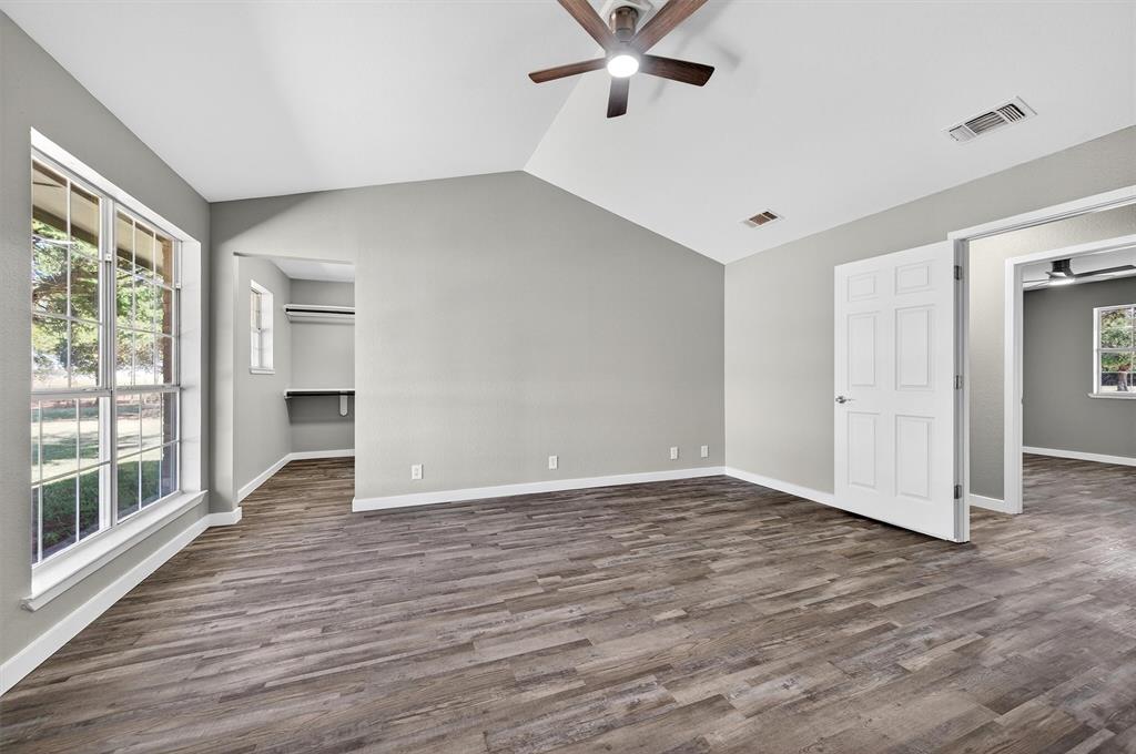5023 West Line Road Whitesboro, TX 76273 - Photo 35 of 40 wooden floor in an empty room with a window