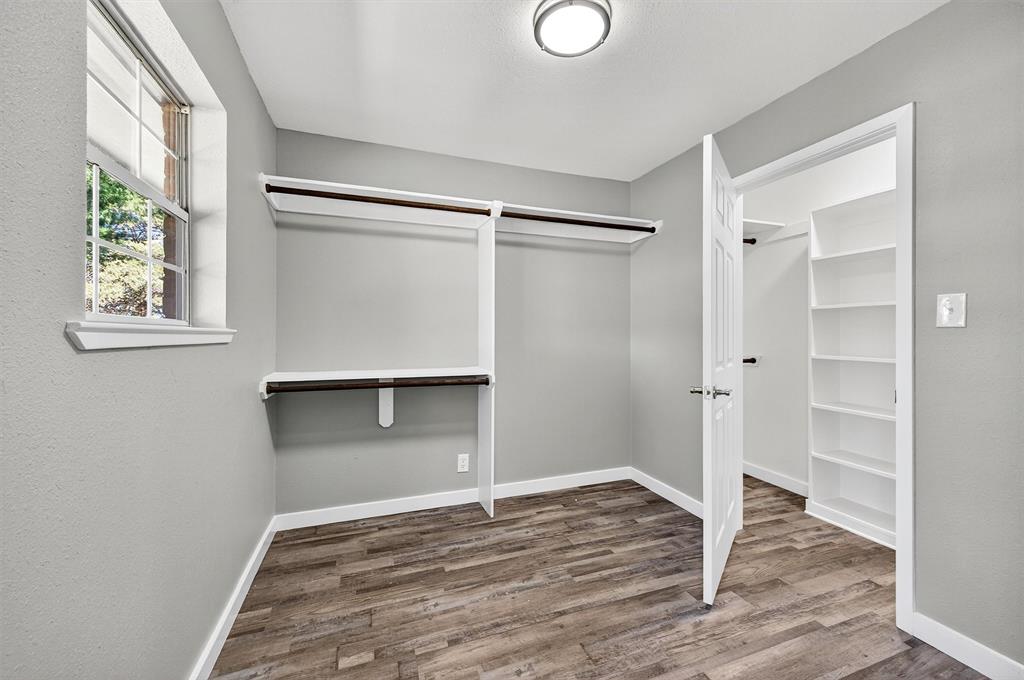 5023 West Line Road Whitesboro, TX 76273 - Photo 36 of 40 a view of an empty room with wooden floor and a window