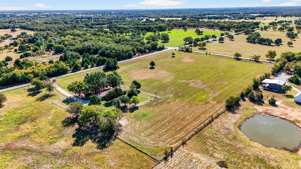 5023 West Line Road Whitesboro, TX 76273 - Photo 4 of 40 an aerial view of residential houses with outdoor space