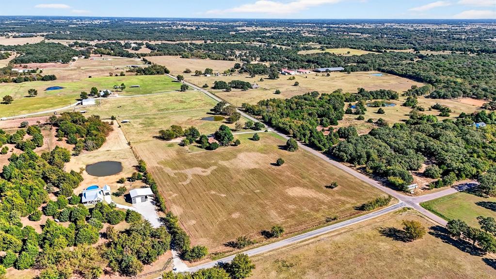 5023 West Line Road Whitesboro, TX 76273 - Photo 6 of 40 an aerial view of residential houses with outdoor space