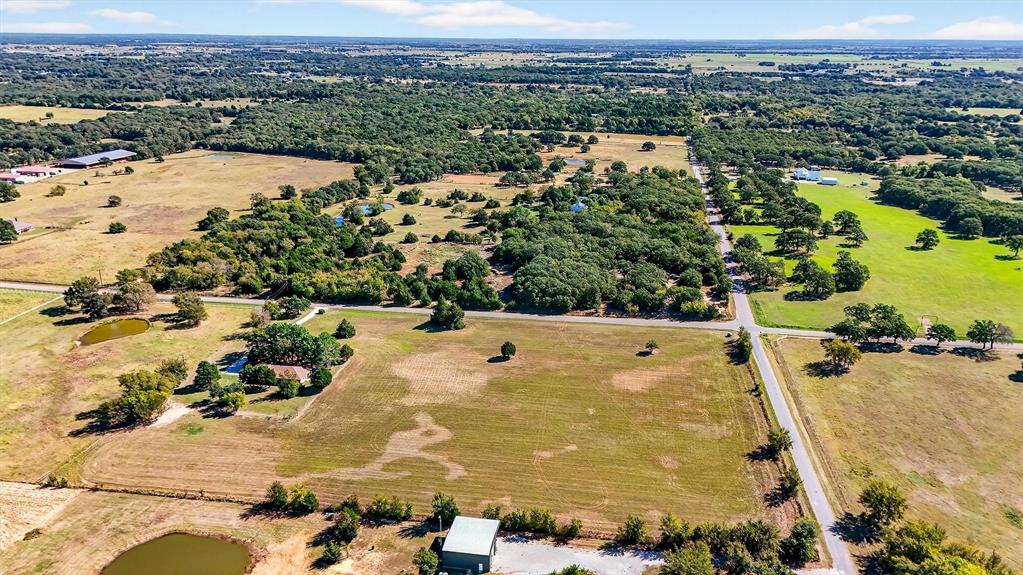 5023 West Line Road Whitesboro, TX 76273 - Photo 7 of 40 an aerial view of residential houses with outdoor space