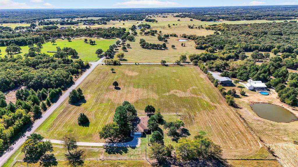 5023 West Line Road Whitesboro, TX 76273 - Photo 8 of 40 an aerial view of residential houses with outdoor space