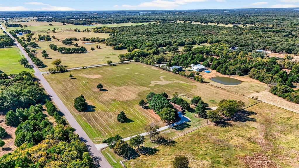5023 West Line Road Whitesboro, TX 76273 - Photo 9 of 40 an aerial view of a house with a yard