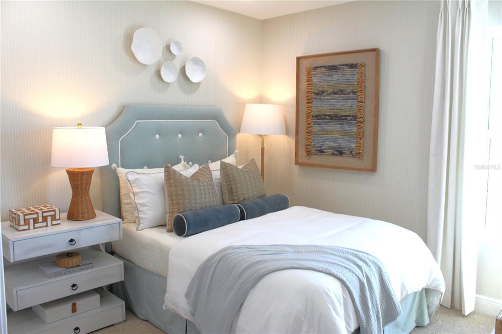 17736 Broadleaf Loop Venice, FL 34293 - Photo 13 of 16 a bedroom with a bed and a dresser