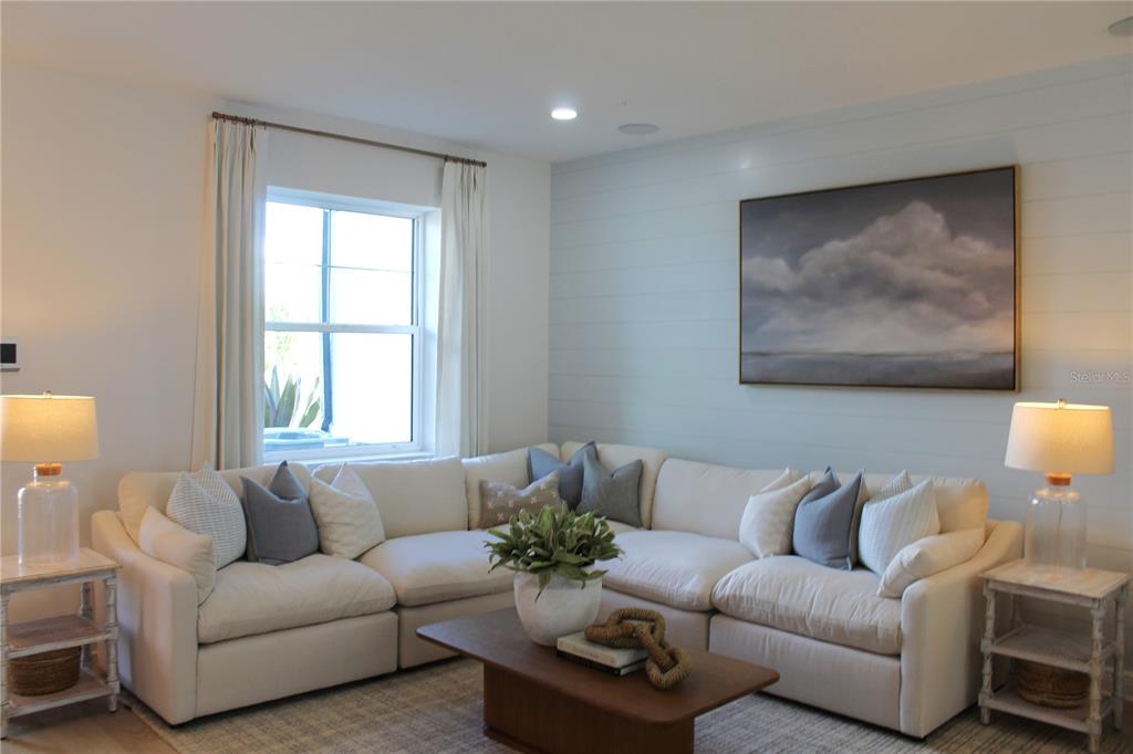 17736 Broadleaf Loop Venice, FL 34293 - Photo 4 of 16 a living room with furniture and a large window