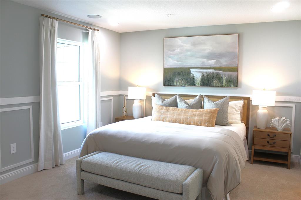 17736 Broadleaf Loop Venice, FL 34293 - Photo 8 of 16 a bedroom with a bed and a window