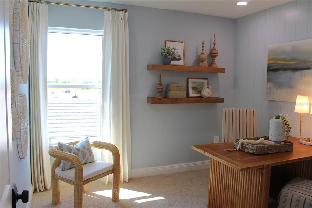 17736 Broadleaf Loop Venice, FL 34293 - Photo 10 of 16 a room that has painting on the wall and a window