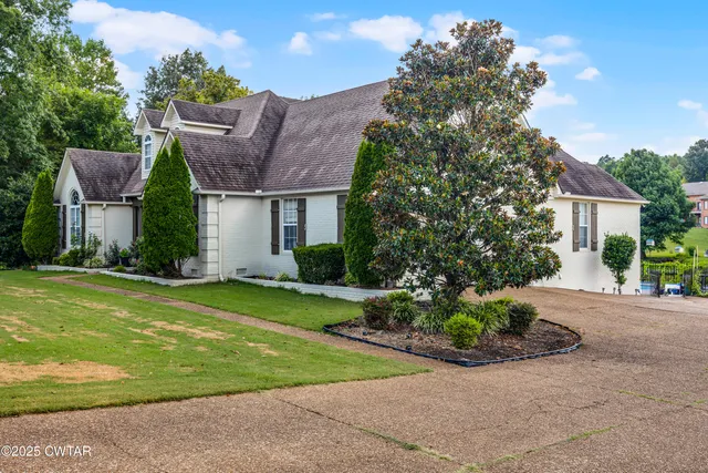 a view of a house with a garden