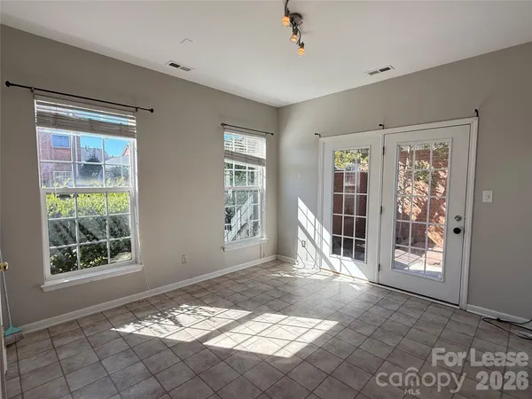 a view of a livingroom with wooden floor and a window