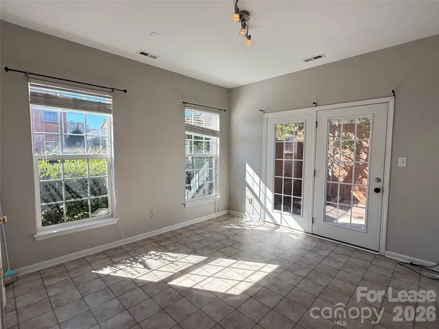 a view of a livingroom with wooden floor and a window