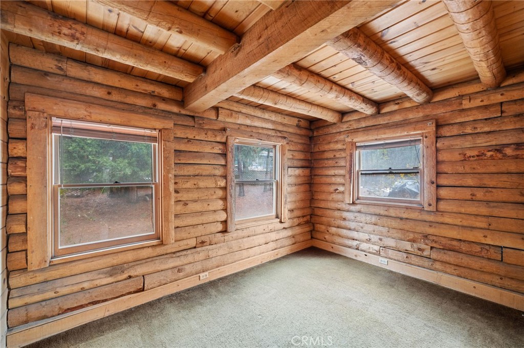 53645 Country Club Drive Idyllwild, CA 92549 - Photo 12 of 33 a view of a room that has wooden walls and a window
