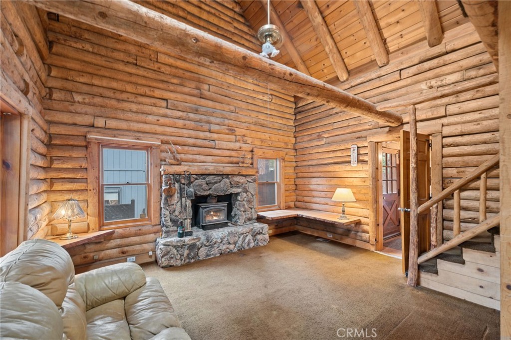 53645 Country Club Drive Idyllwild, CA 92549 - Photo 14 of 33 a living room with furniture and a fireplace