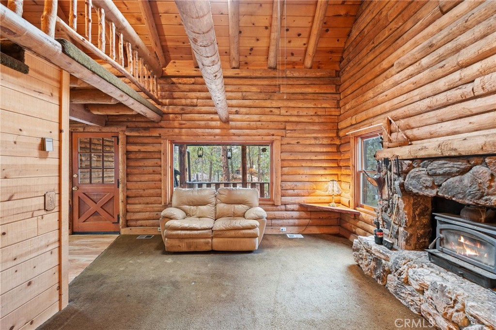 53645 Country Club Drive Idyllwild, CA 92549 - Photo 16 of 33 a living room with furniture and a fireplace