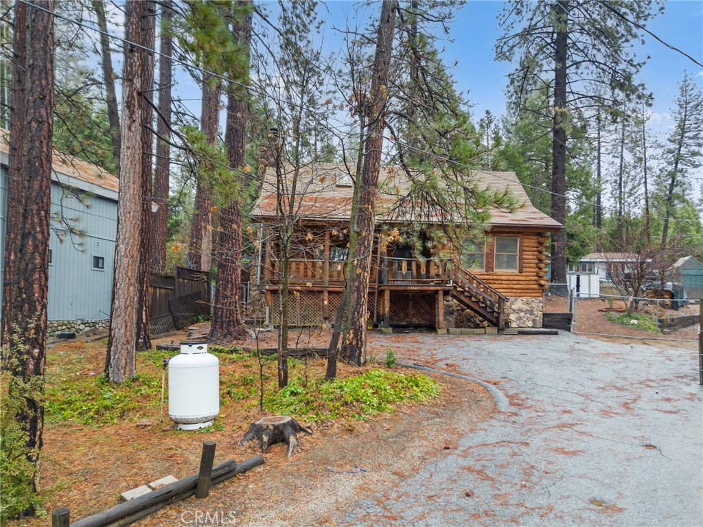 53645 Country Club Drive Idyllwild, CA 92549 - Photo 2 of 33 a view of a chairs and table in backyard