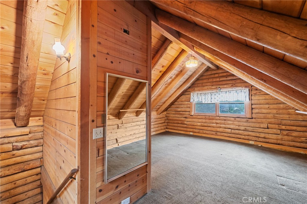 53645 Country Club Drive Idyllwild, CA 92549 - Photo 22 of 33 a view of a balcony with door and wooden walls