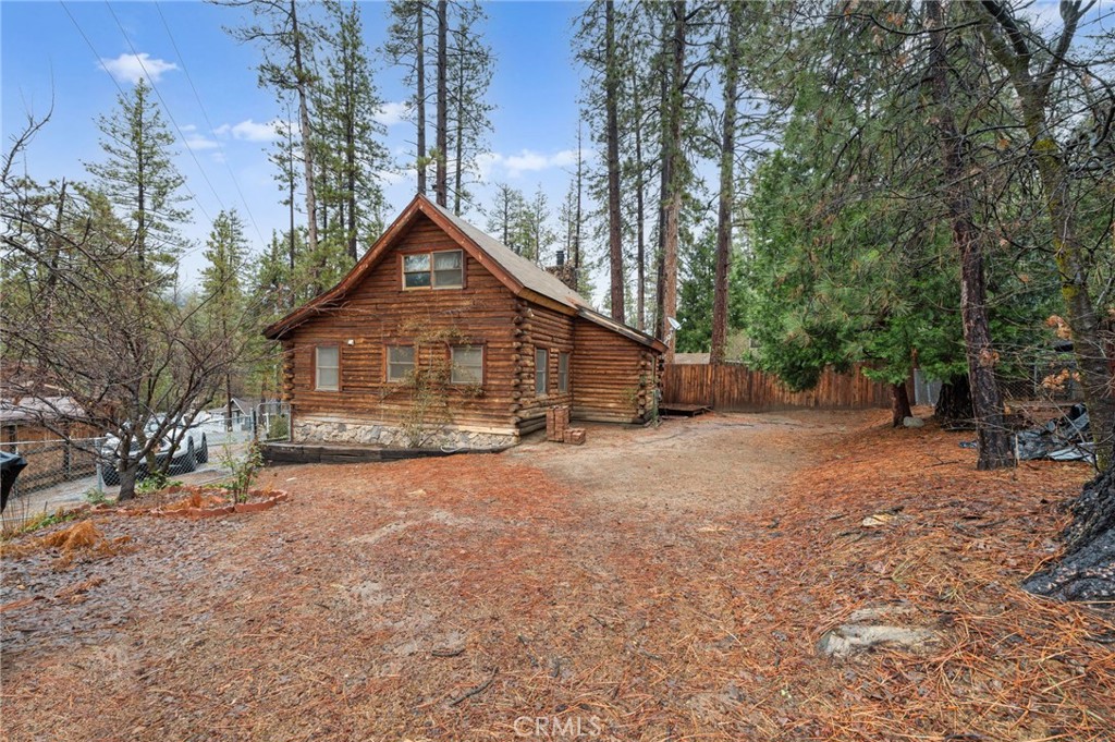 53645 Country Club Drive Idyllwild, CA 92549 - Photo 28 of 33 a front view of a house with a yard and trees