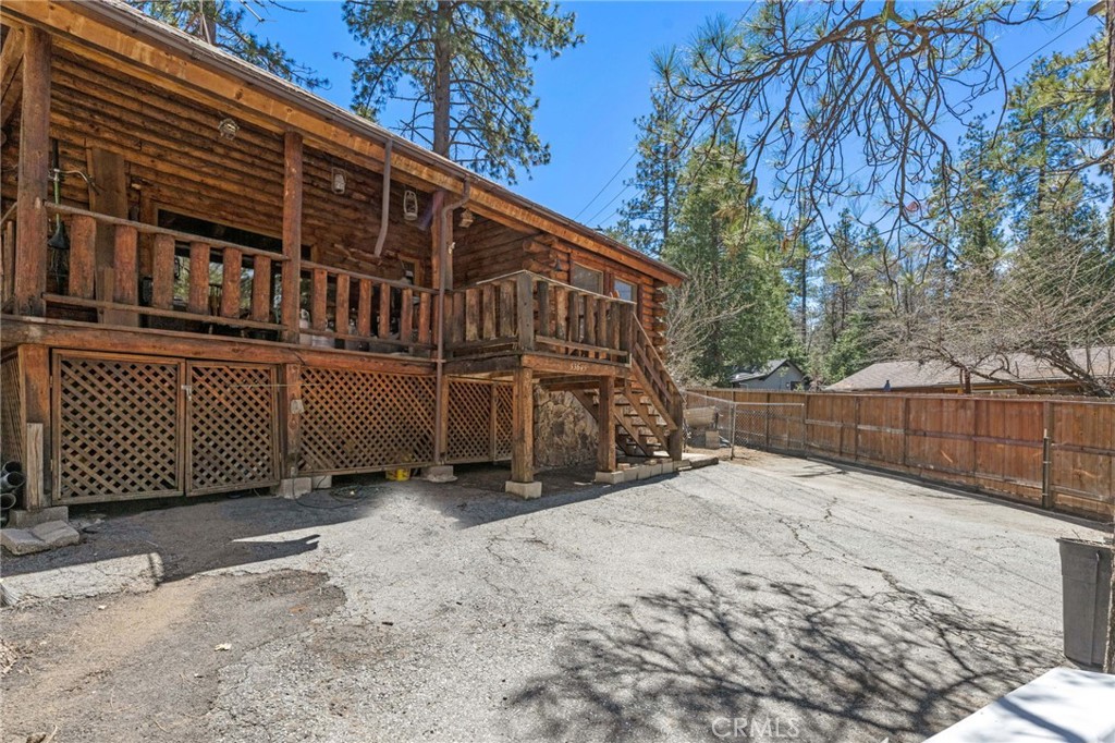 53645 Country Club Drive Idyllwild, CA 92549 - Photo 4 of 33 a view of a house with a wooden fence