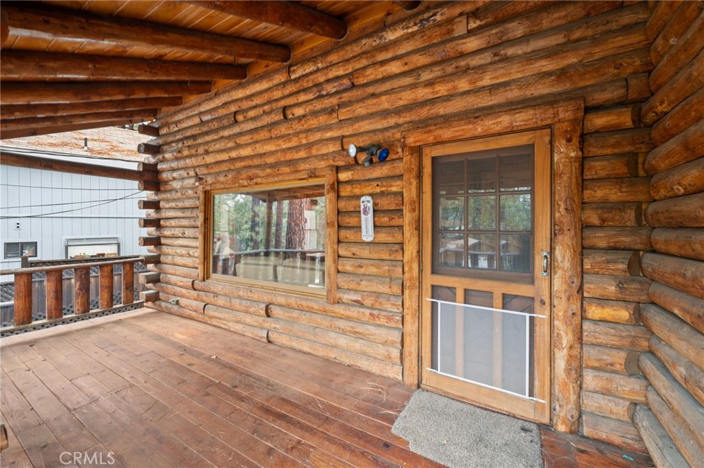 53645 Country Club Drive Idyllwild, CA 92549 - Photo 5 of 33 a view of an empty room with wooden floor and a window