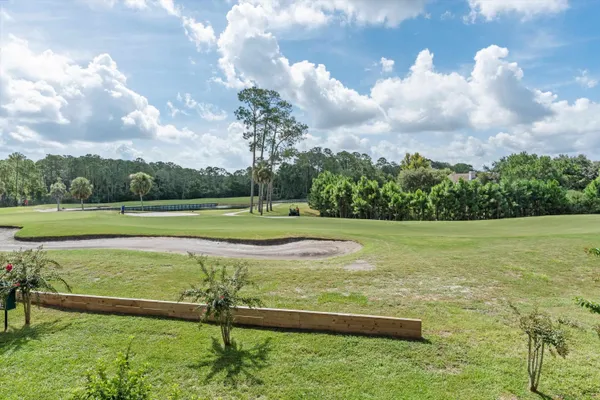 a bathroom with a sink a toilet a mirror and shower curtain