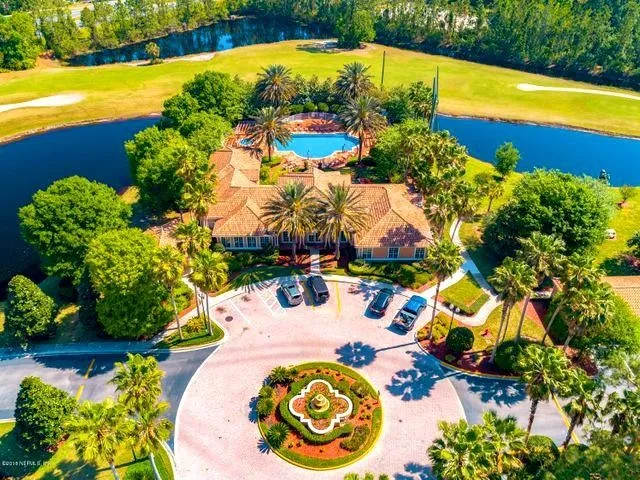 a view of a swimming pool with a yard