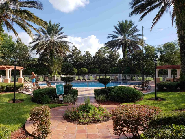 a view of a swimming pool with a patio