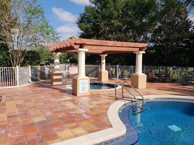 a view of a swimming pool with a patio