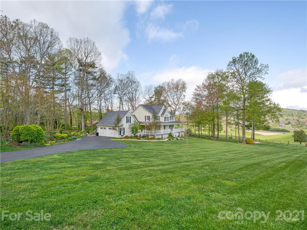 575 Souther Road Fletcher, NC 28732 - Photo 3 of 48 a view of a big yard with a house in the background