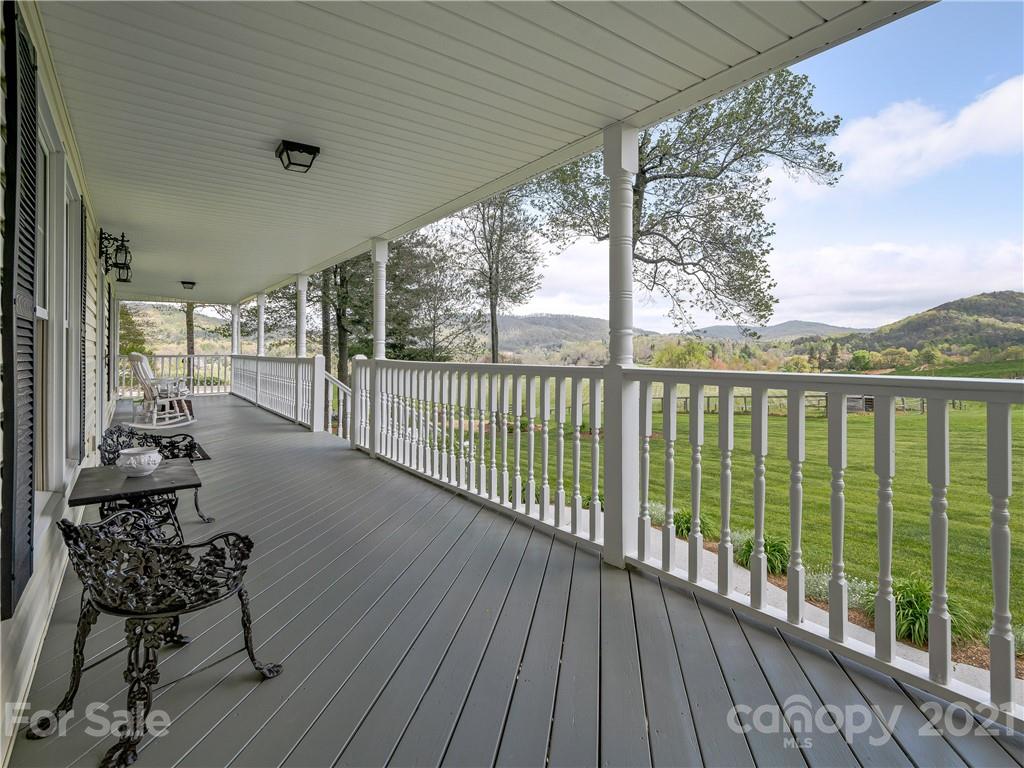 575 Souther Road Fletcher, NC 28732 - Photo 8 of 48 a balcony with wooden floor and outdoor seating