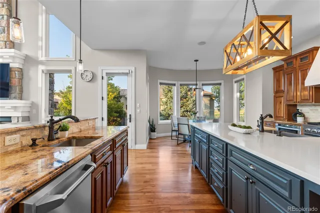 a large kitchen with a table and chairs