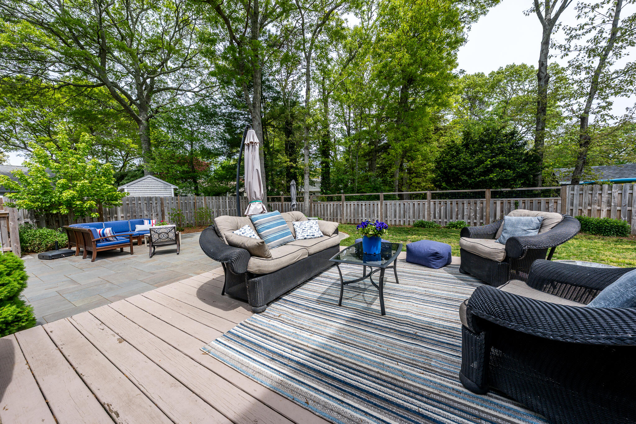 61 Angus Way Centerville, MA 02632 - Photo 34 of 59 a view of a patio with couches chairs and a wooden floor