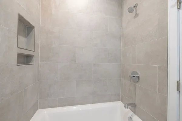 a view of an empty room with a window