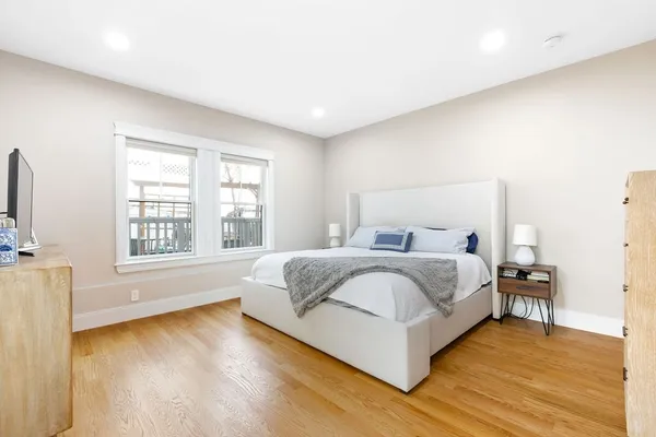 a spacious bathroom with a bathtub and a sink