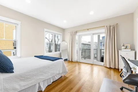 a view of a livingroom with workspace and a window