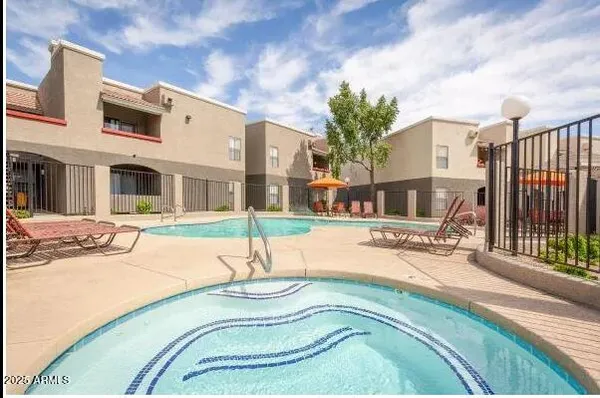 a swimming pool with outdoor seating yard and barbeque oven