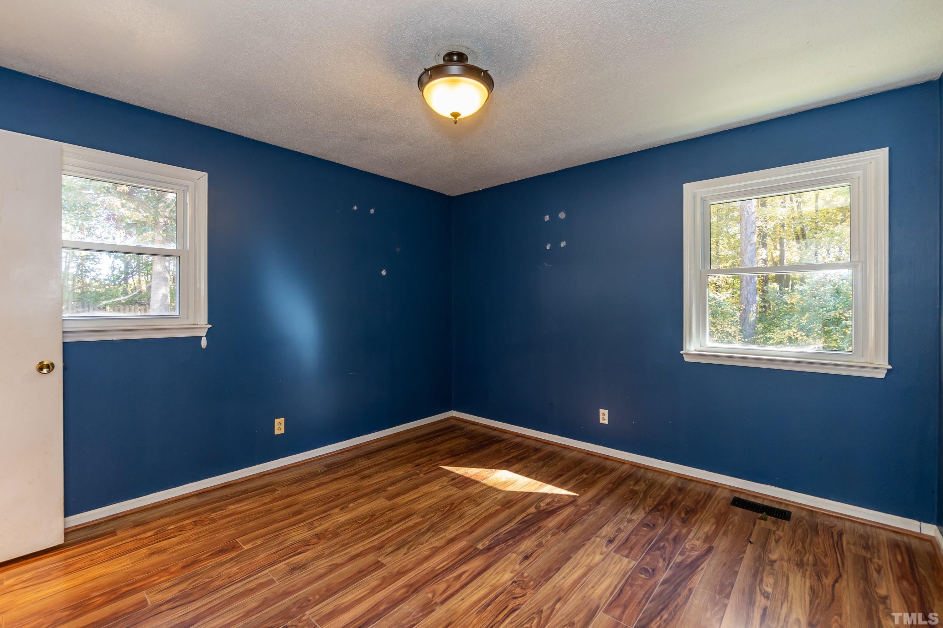 118 Ridgecrest Circle Durham, NC 27712 - Photo 14 of 24 a view of empty room with wooden floor