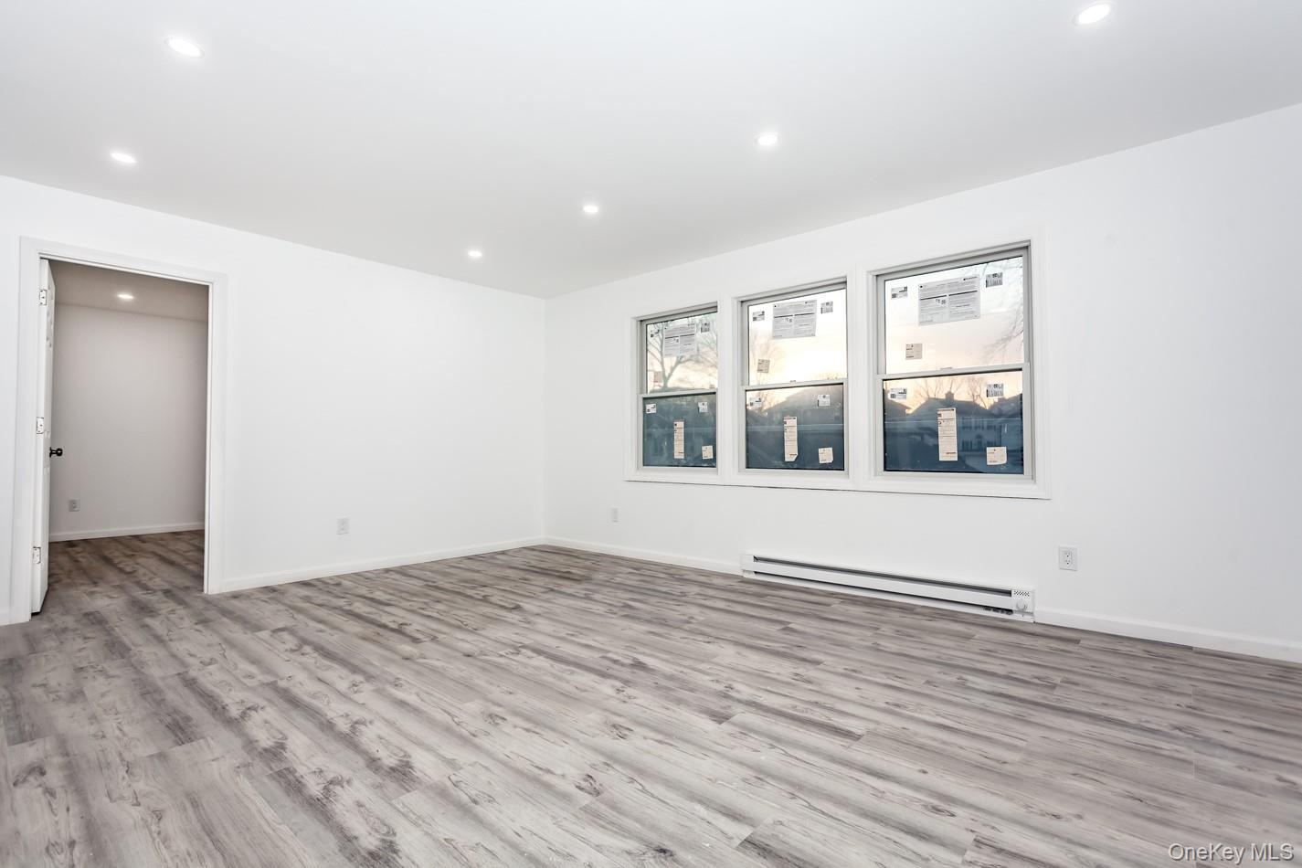 300 Highland Avenue, Unit 5 Peekskill, NY 10566 - Photo 12 of 17 a view of an empty room with wooden floor and a window