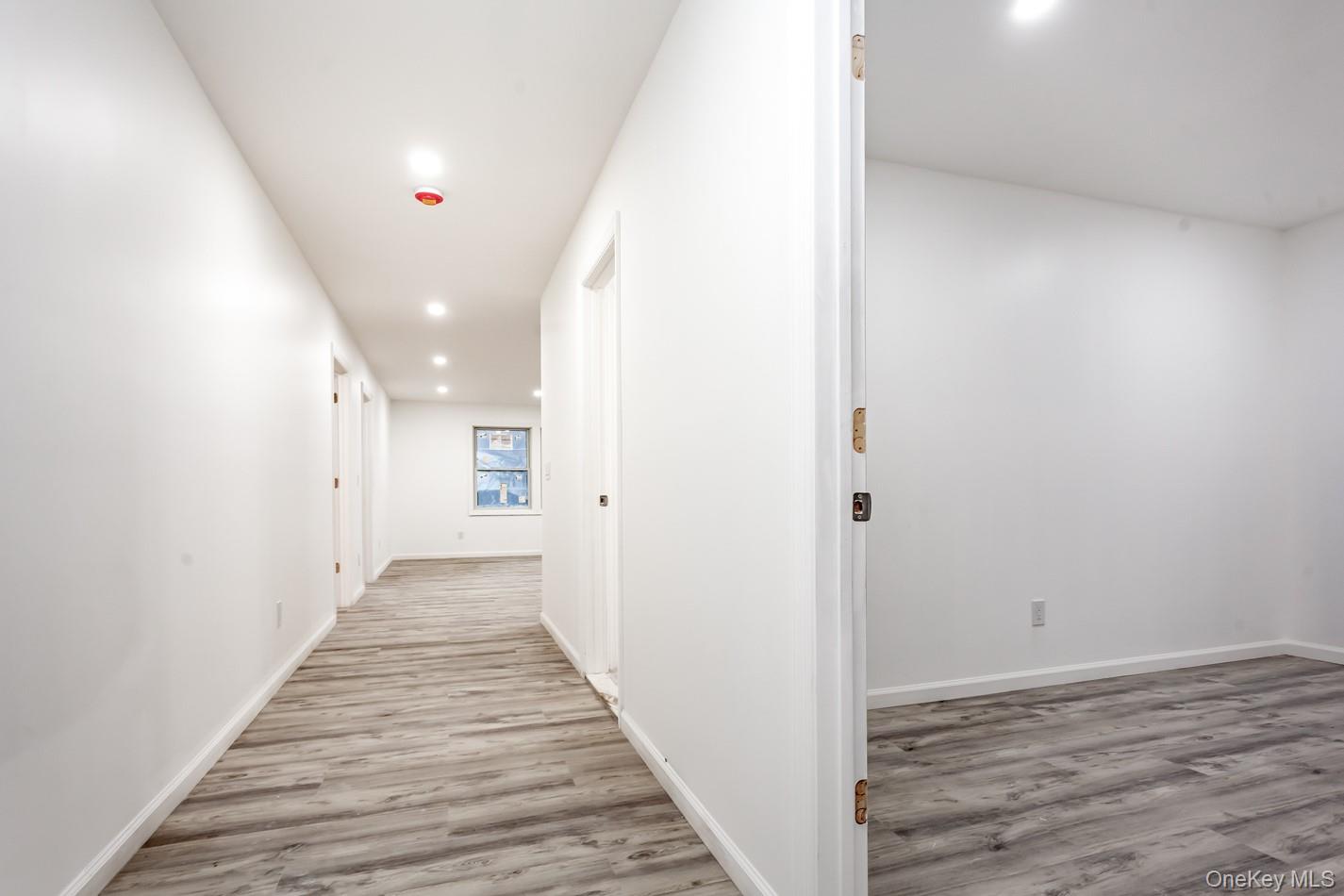 300 Highland Avenue, Unit 5 Peekskill, NY 10566 - Photo 3 of 17 a view of a hallway with wooden floor