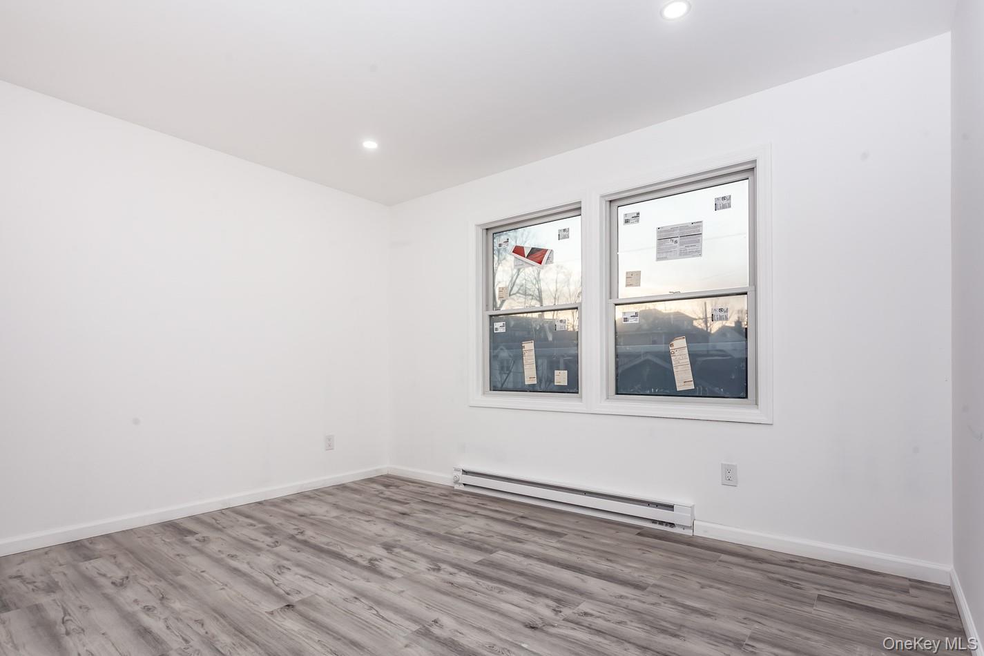 300 Highland Avenue, Unit 5 Peekskill, NY 10566 - Photo 4 of 17 a view of an empty room with wooden floor and a window