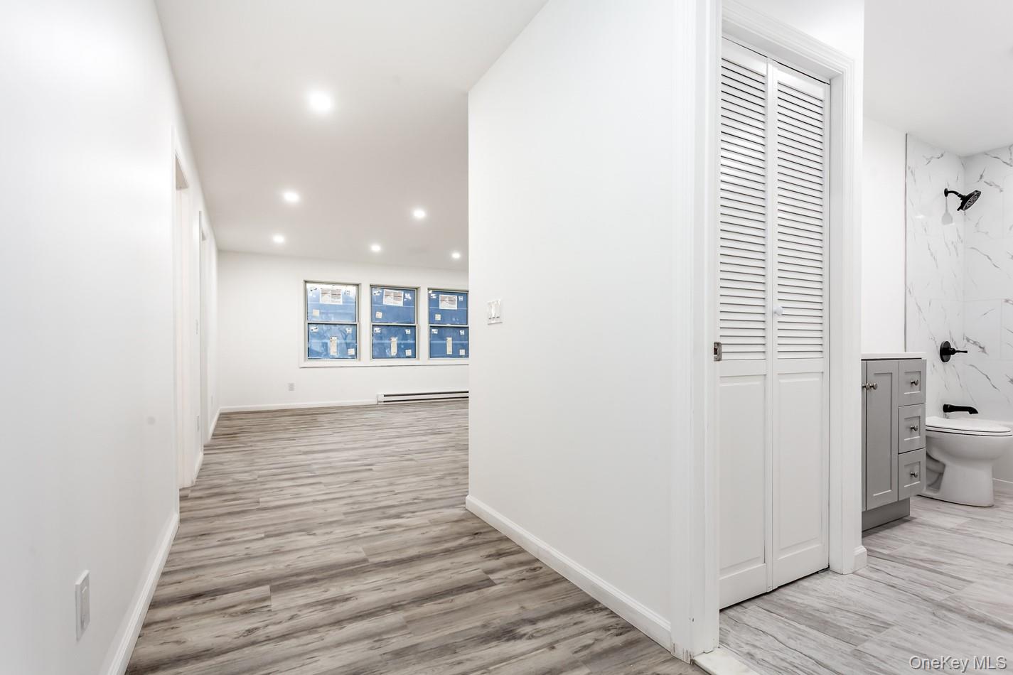 300 Highland Avenue, Unit 5 Peekskill, NY 10566 - Photo 6 of 17 a view of a hallway with wooden floor and a bathroom