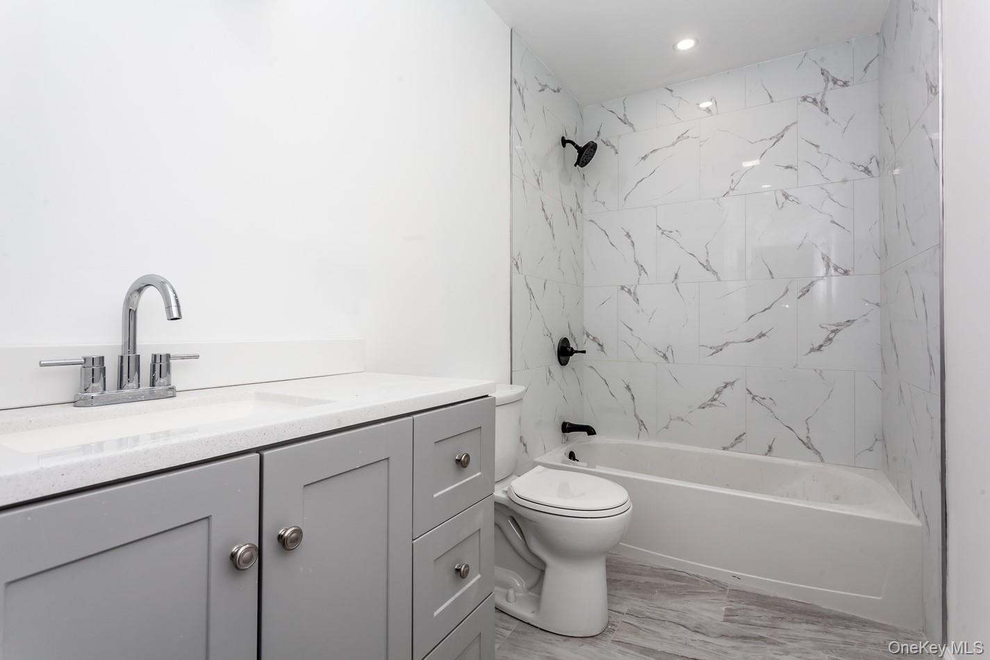 300 Highland Avenue, Unit 5 Peekskill, NY 10566 - Photo 7 of 17 a bathroom with a toilet sink and bathtub