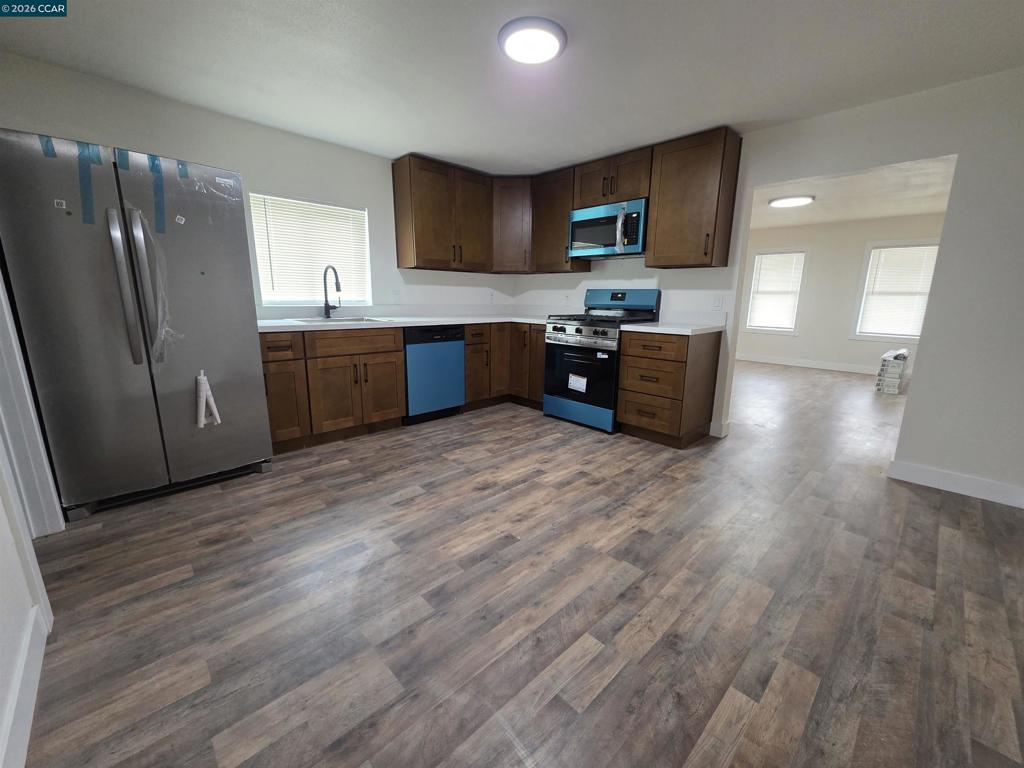 139 Ambrose Avenue Bay Point, CA 94565 - Photo 2 of 13 a kitchen with stainless steel appliances granite countertop a refrigerator a sink dishwasher a stove top oven a refrigerator and cabinets