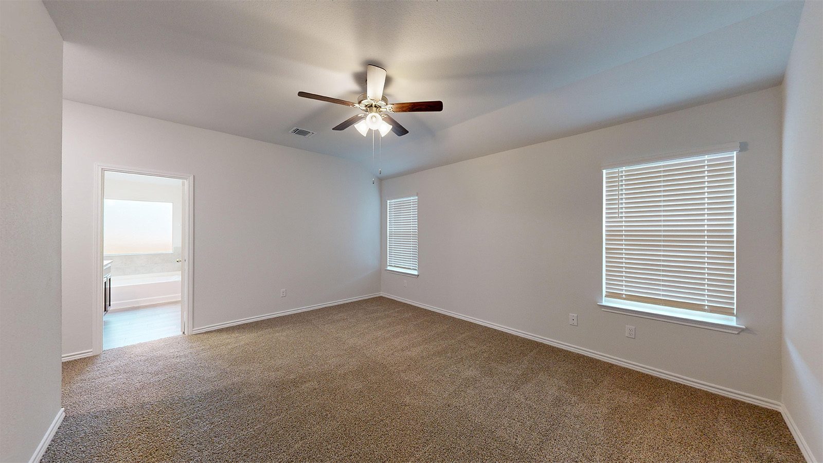 700 Gauge Road Thorndale, TX 76577 - Photo 11 of 22 Spare room featuring carpet, healthy amount of natural light, and ceiling fan
