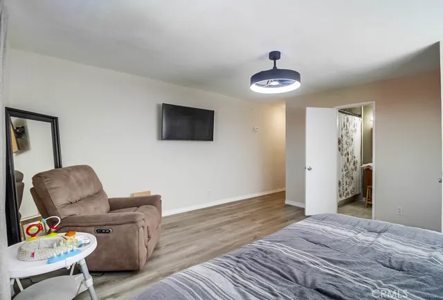 a bedroom with furniture and a window