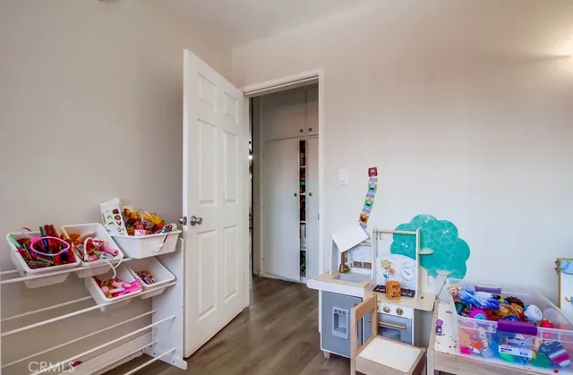 a view of a dining room with furniture and toys